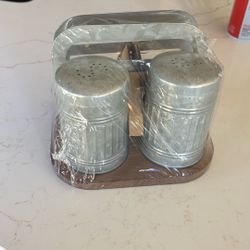 Salt and pepper shakers with napkin holder