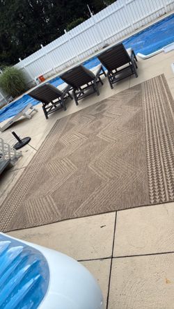 9 1/2 feet by 8 feet tan/natural indoor/outdoor rug