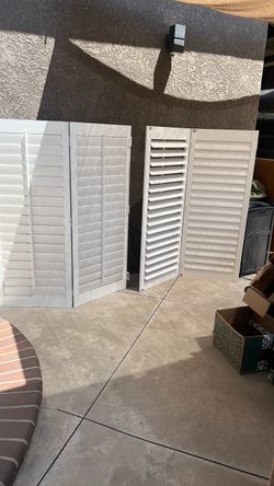 Two white PVC plantation shutters