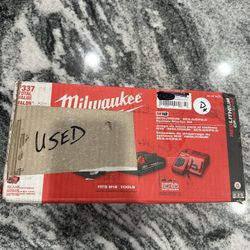Milwaukee, red lithium M18/M12 charger and batteries kit. 