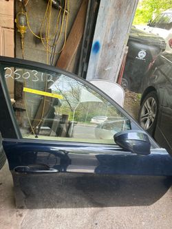 Navy blue 328XI BMW, front passenger door