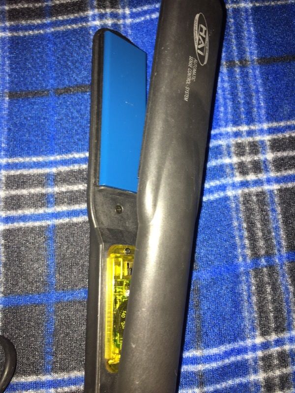 Hai hair straightener with automatic sense control system and LED
