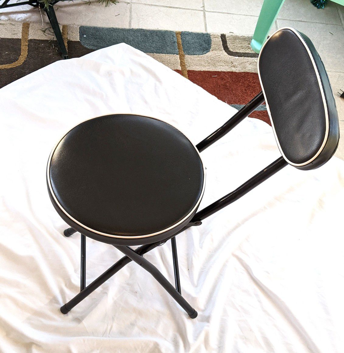 Black cushioned folding chair