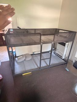 Tugging bunk bed frame with mattress