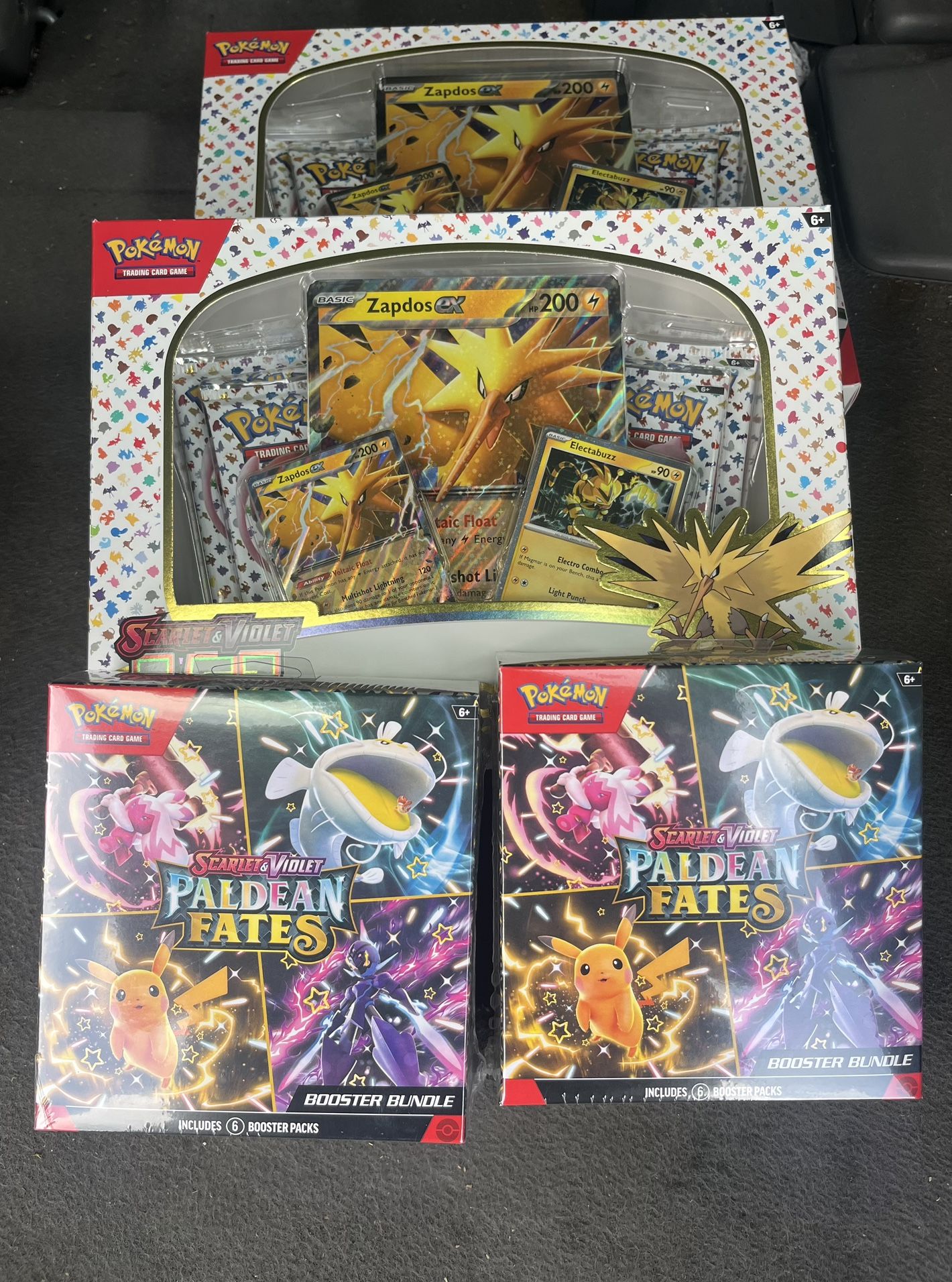 Pokemon 151 zapdos and Paldean fates booster bundles