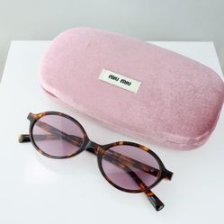 Miu Miu Oval Sunglasses in Tortoise with Pink Lenses