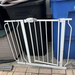 Iron gate for children or pets; measures 33 1/2 inches in length and 31 inches in width.