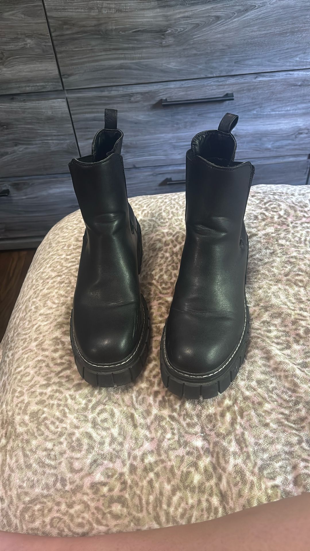 Black platform boots.