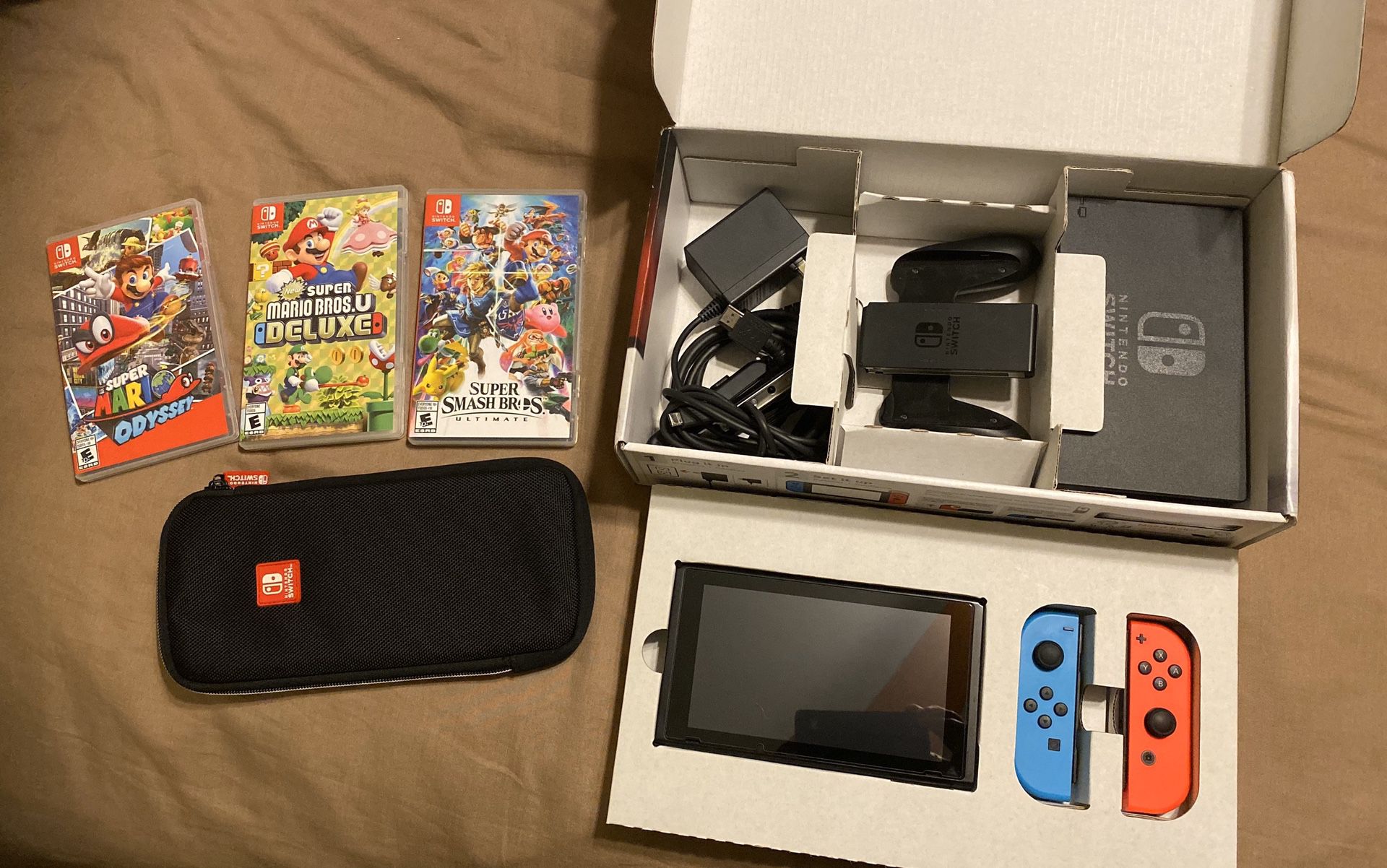 Nintendo Switch with 3 Games, 64gb MicroSD card, and a carrying case