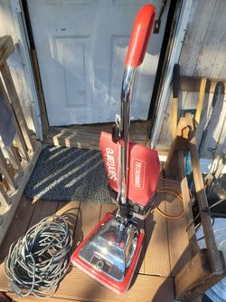 red and chrome Sanitaire Tradition Commercial Upright Vacuum