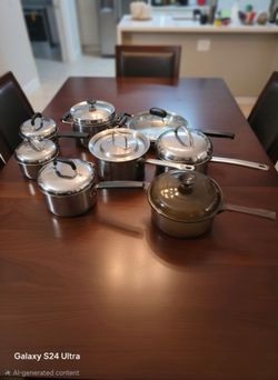8 pots stainless steel USED