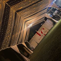 Twinkle Lights And Draped Tents