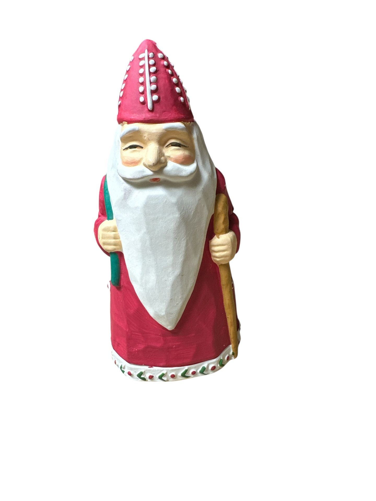 Colonial of Cape Cod Old St. Nicholas taper candle holder. It is a collectible item crafted from ceramic or porcelain. The figurine is designed in a