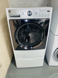 White Kenmore washing machine; includes a receipt for a 90-day warranty.