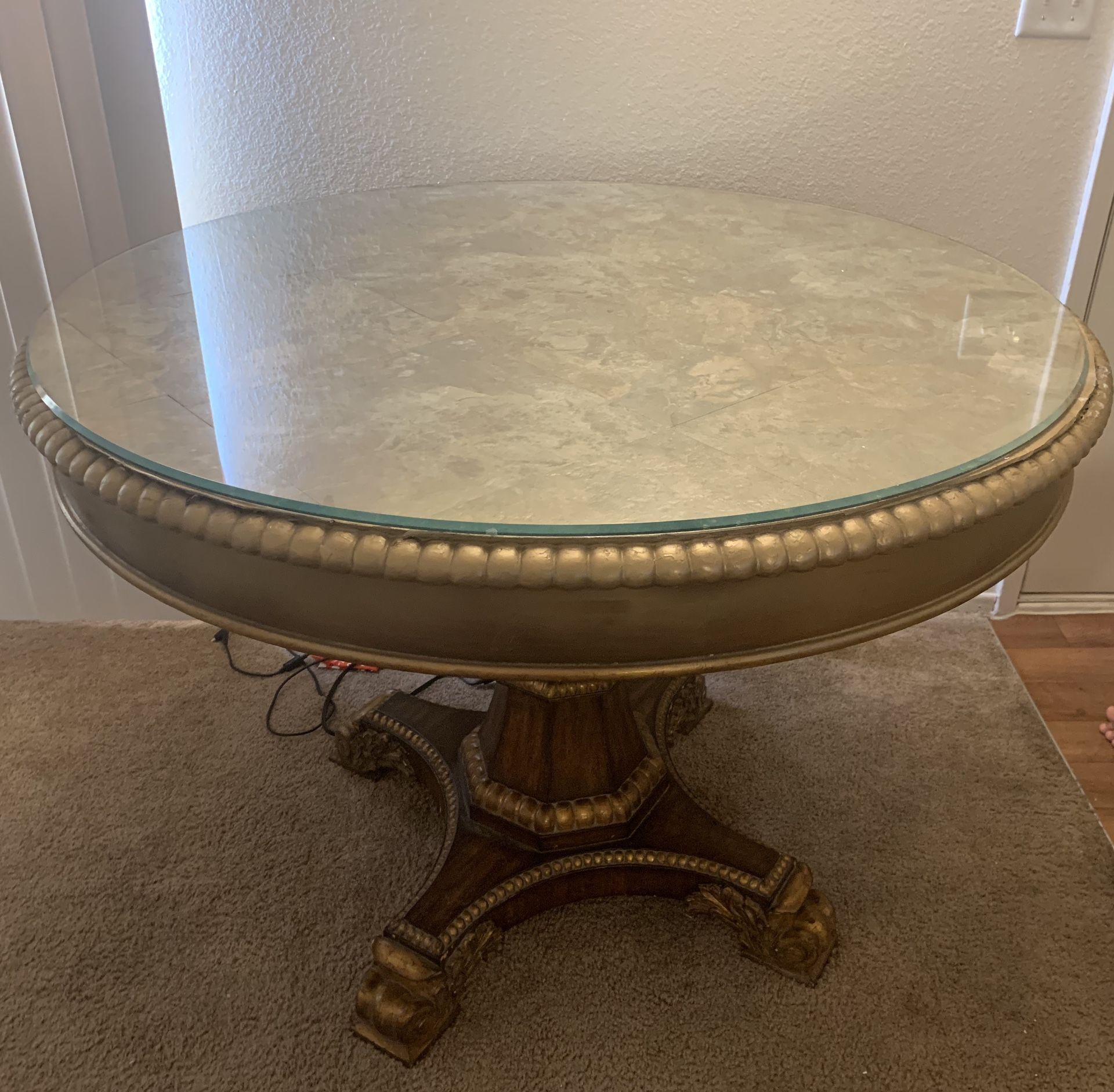 Solid wood table with glass top. Price negotiable