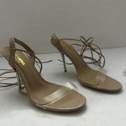 Fashion Nova Tay heeled sandals with clear straps and lucite heels, in a nude or beige color. Size medium 