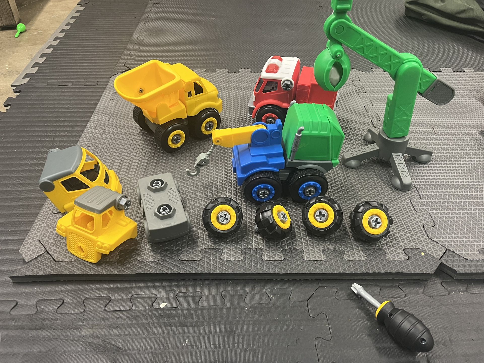 4 Truck Toys With Screw Driver