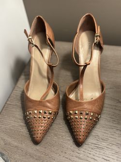 Lovely BCBGeneration High Heel Shoes with Gold studs on them.  Size 8.5 Cognac Brown