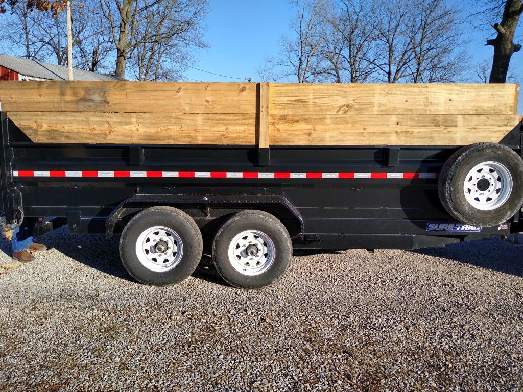 Sure trac 2019dump trailer 16 ft. Long 7ft.wide roll over tarp cargo doors with gravel gate 7000 lbs Axel's twin host like only hauled sawdust
