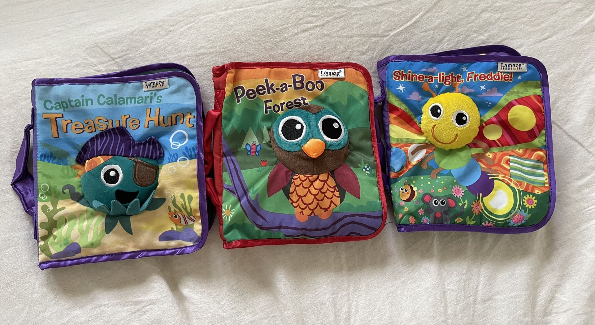 Lamaze cloth Soft Book set of three Peek-a-Boo Forest Captain Calamari's Treasure Hunt Shine-A-Light, Freddie