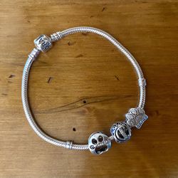 Pandora sterling silver bracelet with three charms size 8”