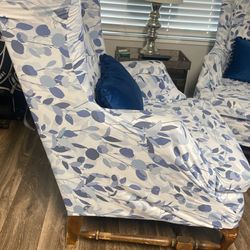 2 Chairs With Two Soft Blue Pillows