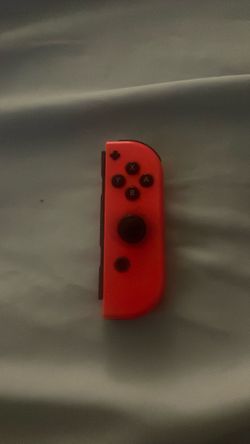 Red Nintendo Switch controller and powerA joy con comfort grip