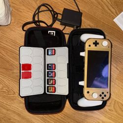 Nintendo Switch Lite With Accessories And Plenty Of Games,