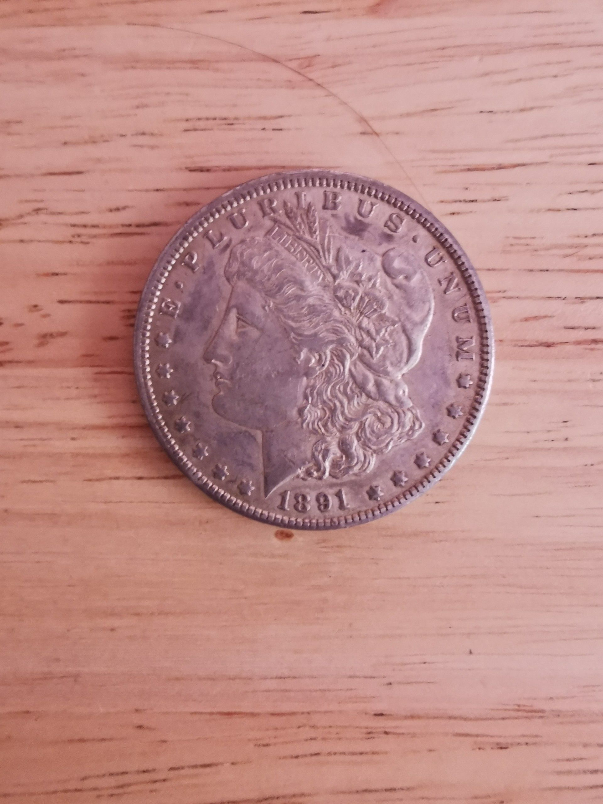 1891 CC Morgan silver dollar. $200 Firm.