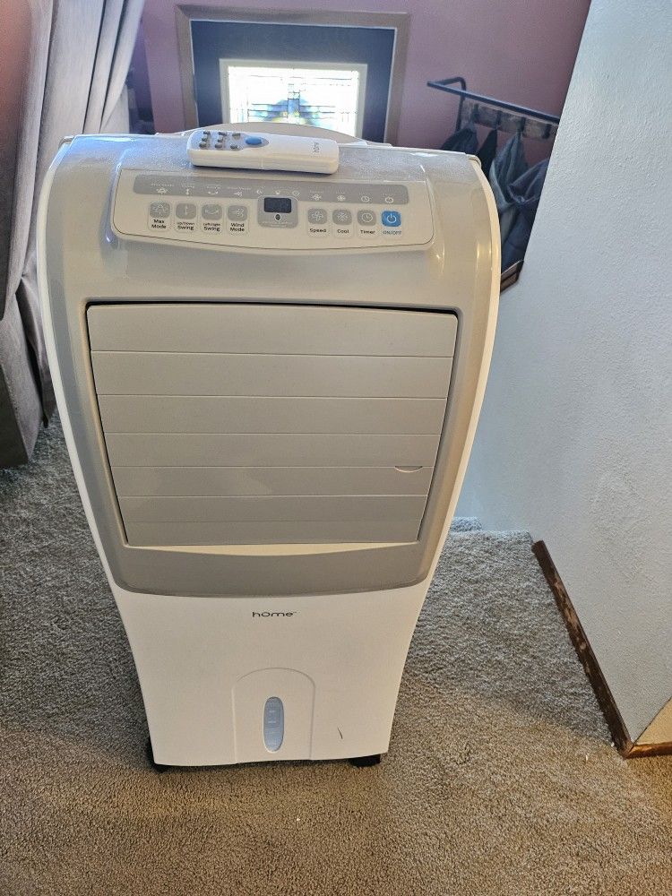 Air conditioner evaporative cooler