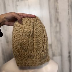 Woman’s brown crochet beanie