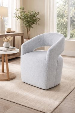 Modern chair with wheels and open backrest