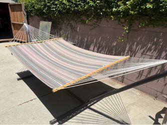 Green hammock and black metal stand