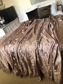 Embroidered white and brown curtain panels