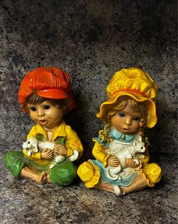 Pair of  hand carved statues.  Boy and Girl
