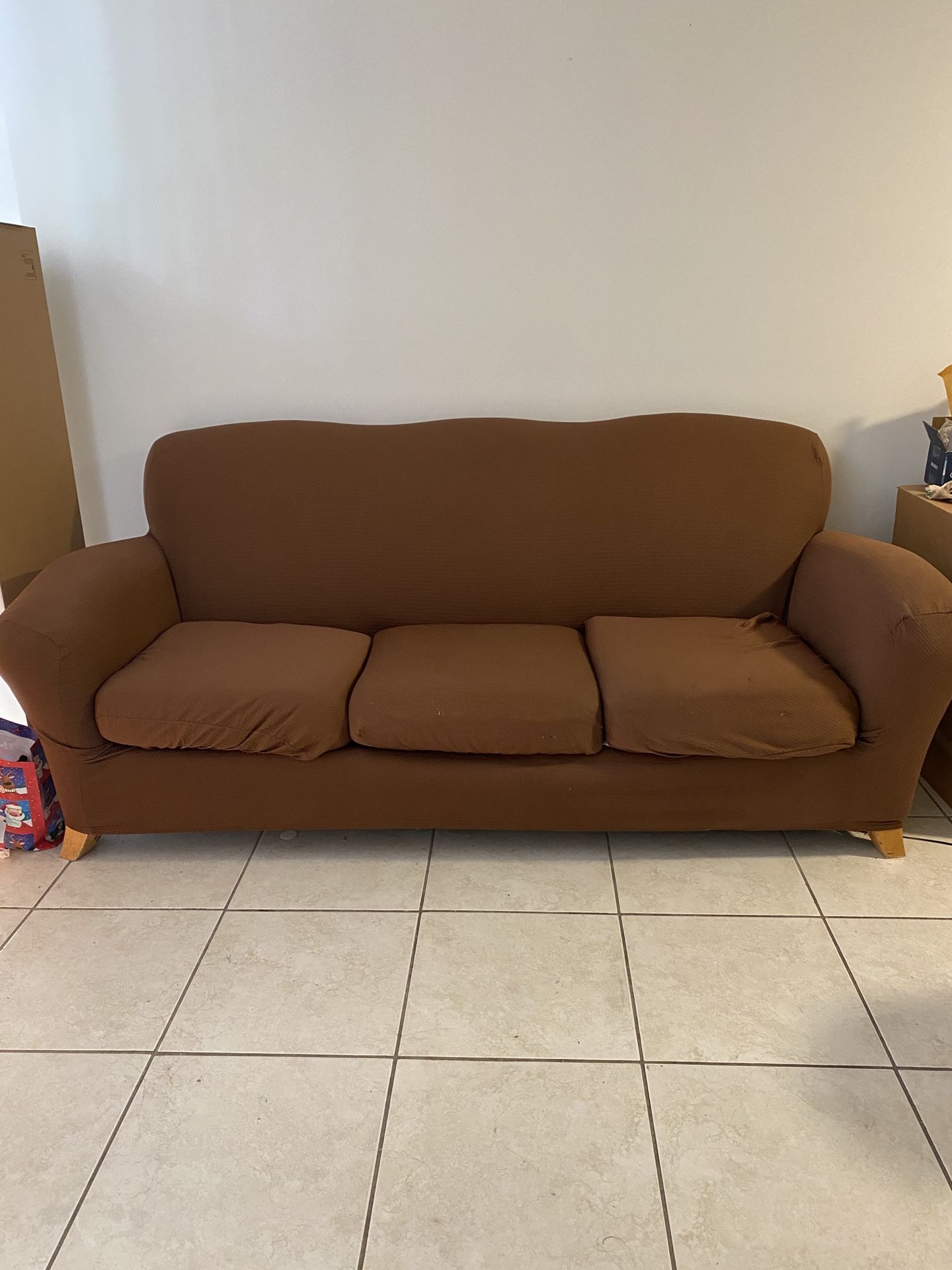 Red couch with Brown Cover