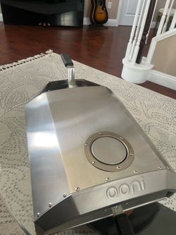 Ooni  pizza oven. Used  two times   Not gas