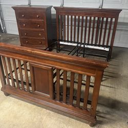Full-size solid wood bed frame with matching dresser.