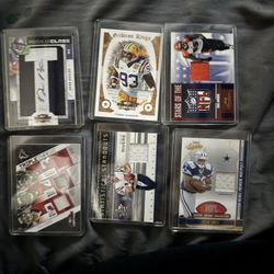 Football cards with torn game jersey inside card