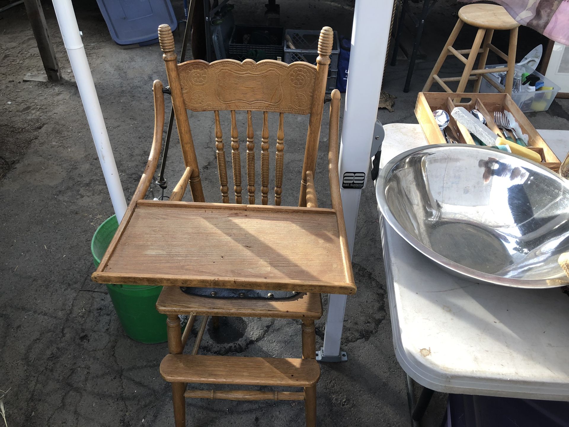 Vintage child’s high chair in good shape with a leather seat
