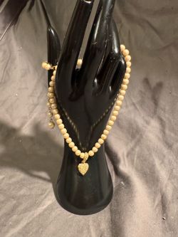 Faux pearls and heart charm