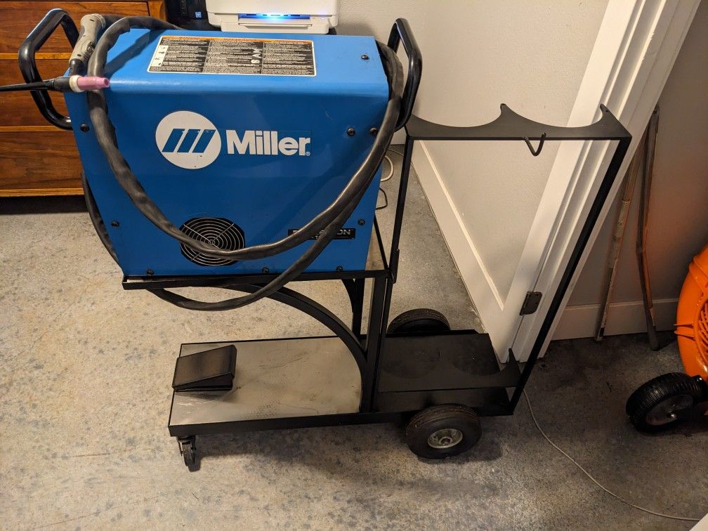 Miller Diversion 165 Tig welder with cart and foot peda. Works great no