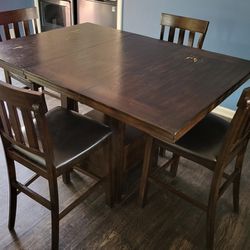 Solid Kitchen Table 5'x3.5' with 18" leaf Inserted. 3' High with 4 Chairs. 