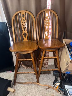 2 wood swivel chairs