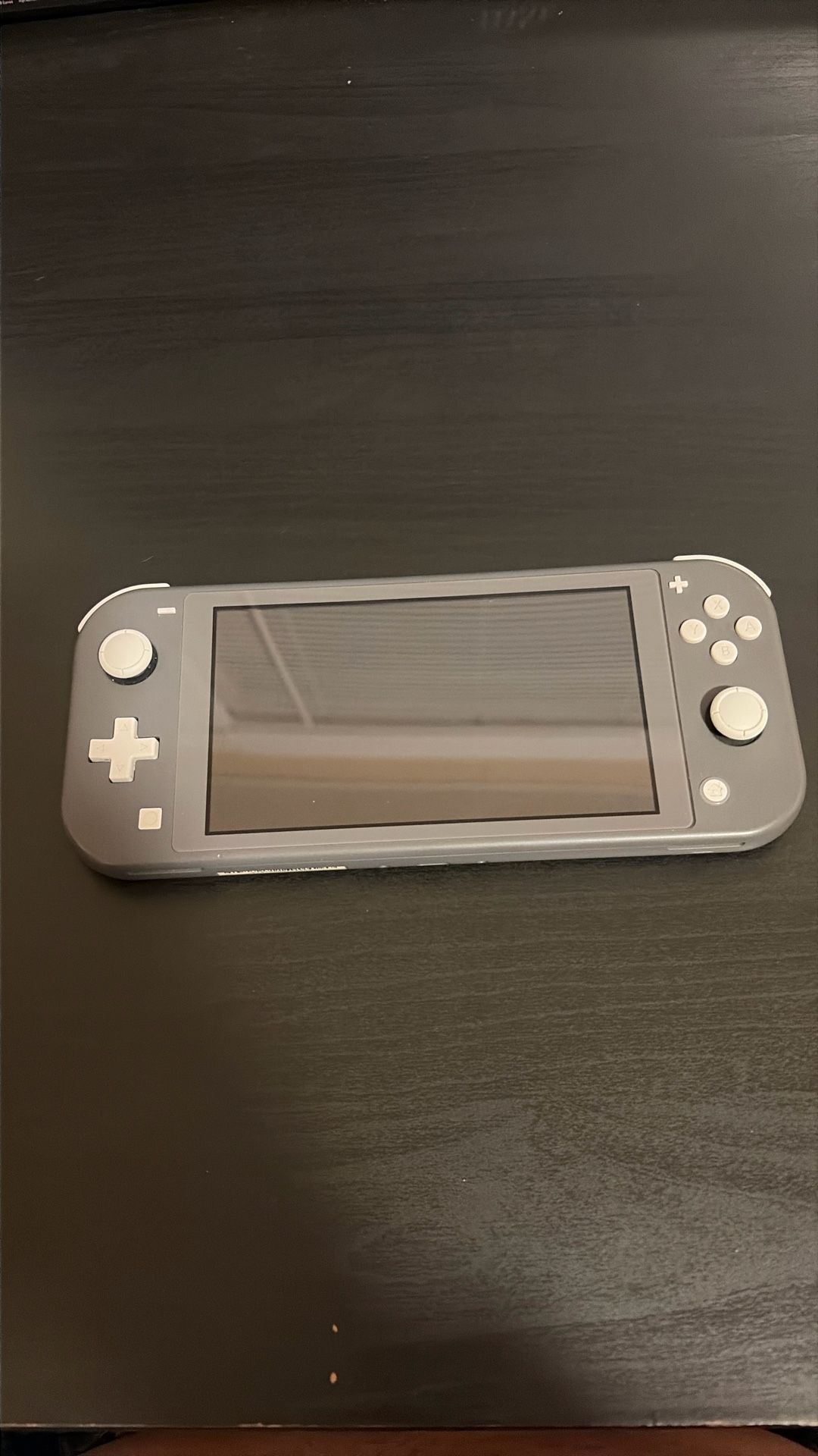 Grey Nintendo Switch Lite. Used Good Condition 