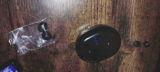 Black earbuds with different sized rubbers