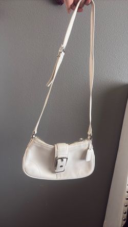 vintage white leather Coach shoulder/hobo bag with the classic front buckle detail