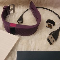 Plum Colored Fitbit Heart Rate Wireless Activity Wristband and wireless activity tracking. 
