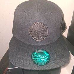 A Snapback Hat Black On Black With A Hand Pressed Aztec Calendar With Authentic Leather