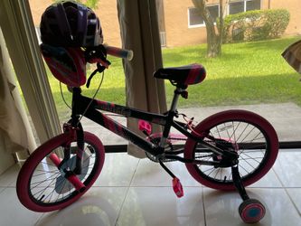 Girls 18” bicycle with training wheels and a helmet